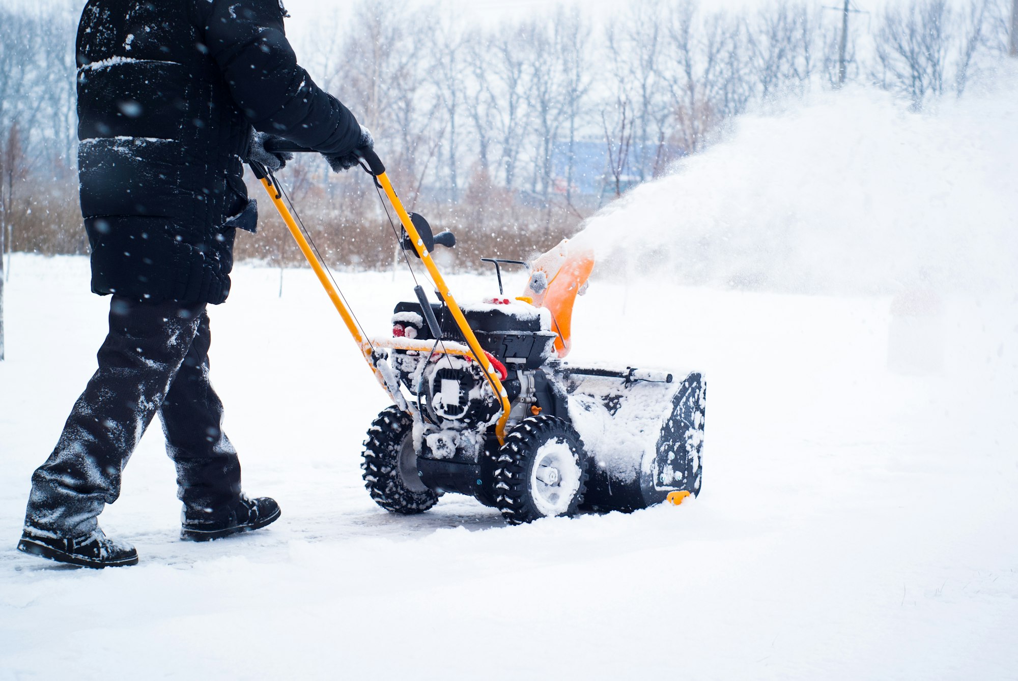 A man cleans snow